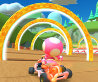 Thumbnail of the Luigi Cup challenge from the Mii Tour; a Ring Race challenge set on Wii Mushroom Gorge