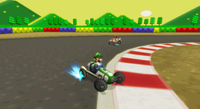 Screenshot of Luigi racing on <small>SNES</small> Mario Circuit 3 in his Classic Dragster from Mario Kart Wii.