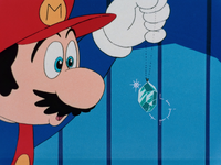 Mario holding Princess Toadstool's Brooch in