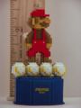Pixelated figurine of Mario standing on a cloud