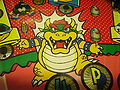 Detail of Bowser artwork. He has blue eyes in this illustration.