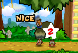 Goombario using his Headbonk on a Goomba.