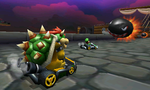 Luigi and Bowser race on the track.