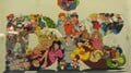 The company’s logo in a poster featuring various cartoon characters.