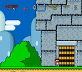 Mario preparing to enter a castle in Super Mario World.