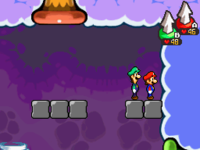 Mario and Luigi hitting the invisible block required to enter a treasure room in Flab Zone.