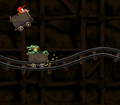 Donkey Kong Country screenshot of Diddy jumping over a Krash in Mine Cart Carnage