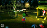 Luigi vacuums up Money from a statue in the Courtyard from Luigi's Mansion for the Nintendo 3DS.