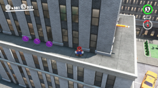 On the ledge of the building next to the Metro Kingdom Slots building.