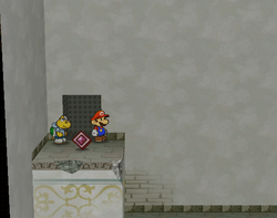 Mario near the Damage Dodge badge in Rogueport Sewers of Paper Mario: The Thousand-Year Door.