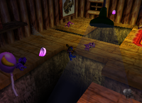 A set of purple Banana Bunches, a purple Banana Balloon and a setup for a Golden Banana in Crystal Caves.