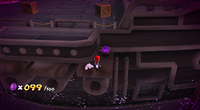 Mario about to collect the 100th Purple Coin on the underground ghost ship.