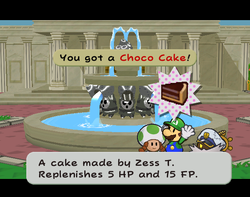 Mario getting a Choco Cake from Toadia in Poshley Heights of Paper Mario: The Thousand-Year Door.