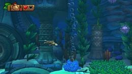 Donkey Kong, swimming towards a column of rising air bubbles in Deep Keep.