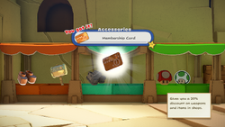 Mario being given the Membership Card by item shop shopkeeper in Picnic Road of The Origami King.