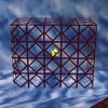 Squared screenshot of a vertical wire net from Super Mario 64.