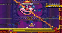 A screenshot of Wario fighting Chortlebot.