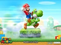 A statue of Mario riding Yoshi made by First4Figures.