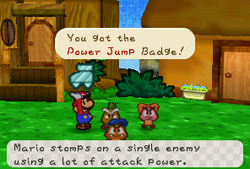 Goompa giving Mario the Power Jump Badge at Goomba Village.