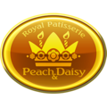 A Peach and Daisy Royal Patisserie gold badge from Mario Kart Tour