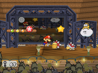 Mario uses his Hammer to attack a member of Spike Storm in Glitz Pit
