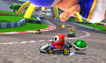 Shy Guy, Bowser, and a Mii driving past the first turn