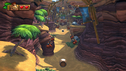 Donkey Kong prepares to launch himself between a series of swinging bombs in Cannon Canyon