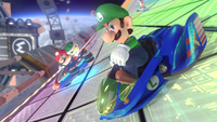 Luigi drives in the Blue Falcon on Rainbow Road in Mario Kart 8.