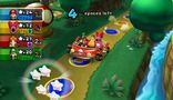 Mario, Birdo, Daisy, and Luigi riding the Toad Mobile in Toad Road